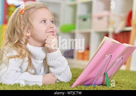 Cute little girl reading book  Stock Photo