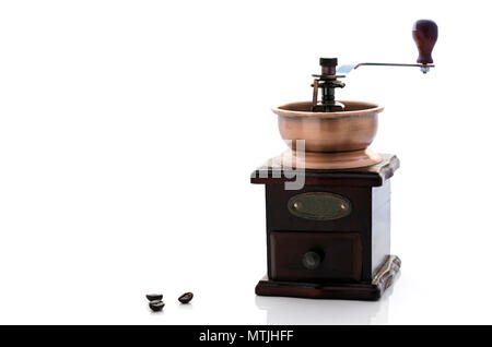 Wooden vintage grinder and coffee beans  on white background with copy space Stock Photo