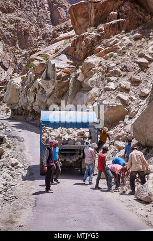 Workmen collection stone on road in Ladakh Stock Photo