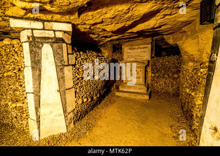 The macabre world of the Paris Catacombs filled with skeletal remains makes for a very unusual tourist attraction Stock Photo