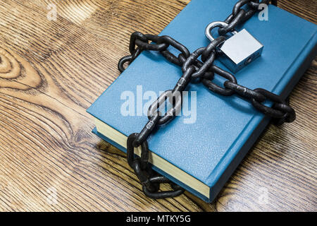 Information security concept, book with chain and padlock Stock Photo
