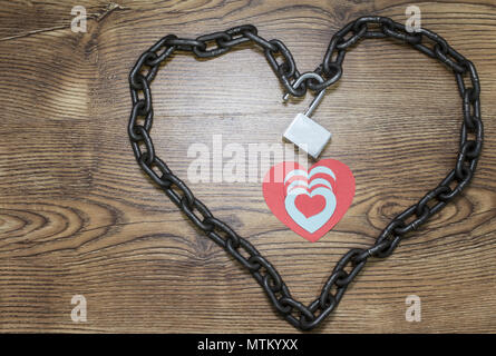 Red, blue heart cards inside the chained heart Stock Photo