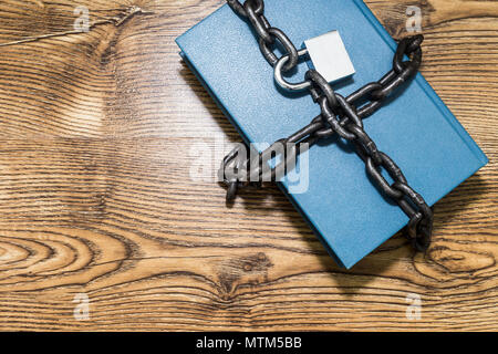 Information security concept, book with chain and padlock Stock Photo