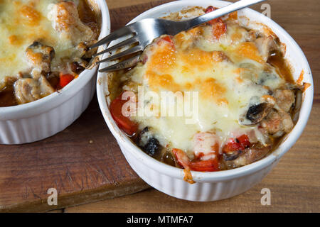 Individual oven dish of traditional Turkish Chicken casserole, Tavuc guvet Stock Photo