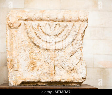 Stone Lintels decorated with seven-branched Menorah candelabrum.That is one of the oldest symbols of the Jewish people, Jerusalem, Israel