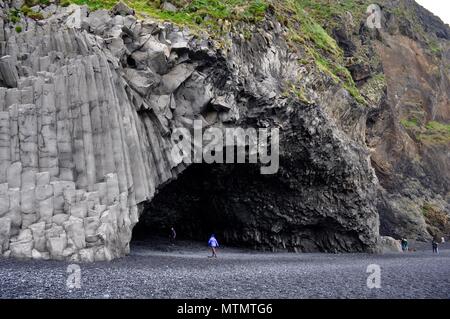 Basalt columns and cave at Reynisfjara black sand beach in Iceland ...