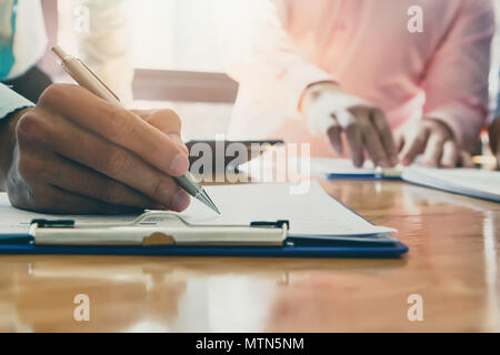 Businessman writing or pointing on report paper. Business strategy concept. Stock Photo