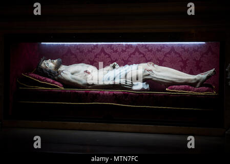 Naples, Italy - April 17, 2018. A statue of Jesus Christ's body after the crucifixion wearing the Crown of Thorns, inside Gesu Nuovo church. Stock Photo