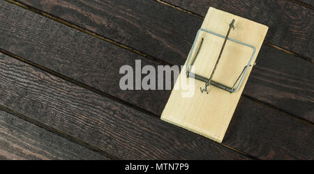 from top view of mouse trap on wooden background Stock Photo