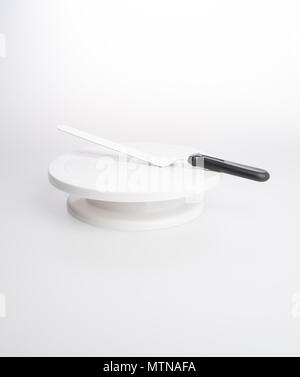 cake stand with cake spatula on a background Stock Photo
