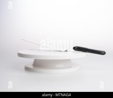 cake stand with cake spatula on a background Stock Photo