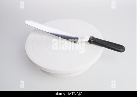cake stand with cake spatula on a background Stock Photo