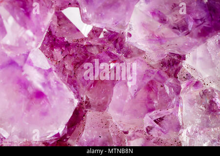 Amethyst. The texture of the mineral. Macro shooting of natural gemstone. The raw mineral. Abstract background. Stock Photo
