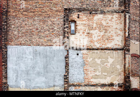 Demolished old brick building wall, grunge background. Stock Photo