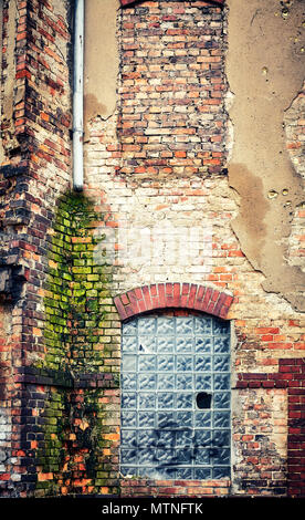 Demolished old brick building wall, color toned picture. Stock Photo