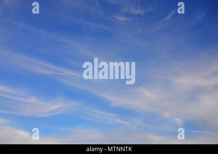 Heavenly space of blue color with a lot of thick white clouds ...