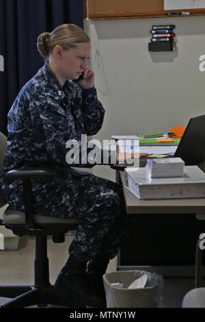 U.S. Navy Petty Officer 1st Class Tara Goodell, Joint Task Force - National Capital Region (JTF-NCR), coordinates special events logistics for the 58th Presidential Inauguration in Washington, D.C., Jan. 4, 2017. The JTF-NCR is a joint service command that coordinates all military ceremonial support for the Inauguration. It includes members from all branches of the armed forces of the United States. (U.S. Army photo by Spc. Lance Hartung) Stock Photo