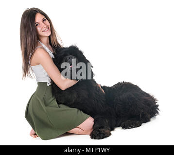 newfoundland dog and woman in front of white background Stock Photo