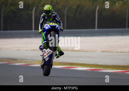 Nine times World Champion Valentino Rossi astride his Movistar Yamaha M1 factory bike at the official MotoGP winter test at Sepang circuit in Malaysia. Stock Photo