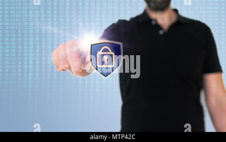 man touching data security or data privacy icon on translucent screen with binary code Stock Photo