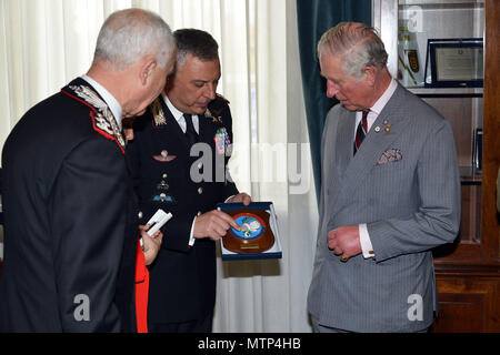 Brig. Gen. Giovanni Pietro Barbano, Center of Excellence for Stability Police Units (CoESPU) director (center), presents Carabinieri CoESPU crest to His Royal Highness, Prince Charles, Prince of Wales, during visit at Center of Excellence for Stability Police Units (CoESPU) Vicenza, Italy, April 1, 2017. (U.S. Army Photo by Visual Information Specialist Paolo Bovo/released)