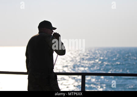 https://l450v.alamy.com/450v/mtp6xx/chief-warrant-officer-3-patrick-thompson-executive-officer-with-the-411th-transportation-detachment-gives-commands-to-a-rescue-boat-for-a-man-overboard-drill-while-aboard-the-logistics-support-vessel-5-lsv-5-mg-charles-p-gross-in-the-arabian-gulf-jan-24-2017-us-army-photo-by-staff-sgt-dalton-smith-mtp6xx.jpg