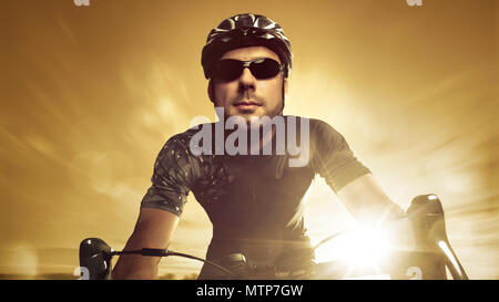 Front view of a racing cyclist during sunset Stock Photo - Alamy