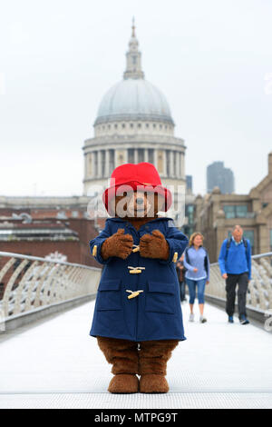 Paddington Bear poses on the Millennium Bridge in front of St Paul's  Cathedral in London, to mark the release of Michael Bond's final book,  Paddington at St Paul's Stock Photo - Alamy