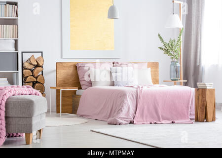 Simple Pink Bedroom With Cozy Big Bed And Wood Supplies