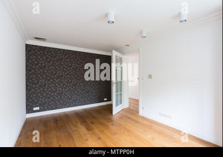 Empty, spacious and light room with decorative wallpaper Stock Photo