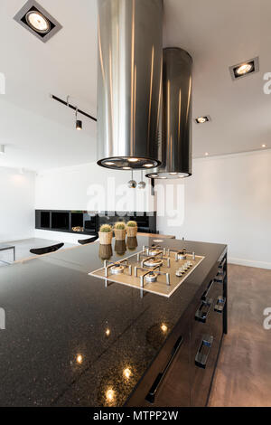 Black high-gloss open kitchen in luxurious style Stock Photo