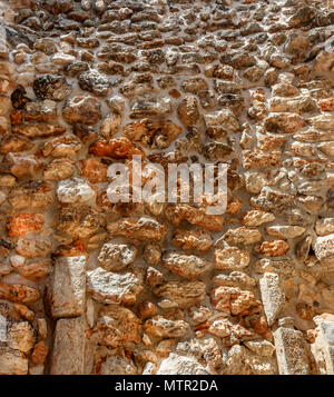 Wall of untreated stone of the ancient city of Maya Stock Photo