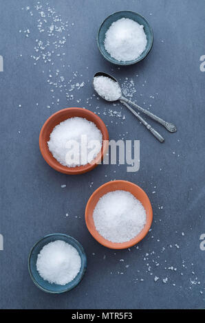 Salt in rustic ceramic bowls, top view Stock Photo