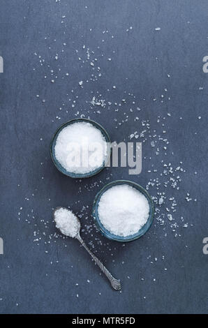 Salt in rustic ceramic bowls, top view Stock Photo