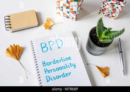 BPD- Borderline Personality Disorder written in notebook on white table Stock Photo
