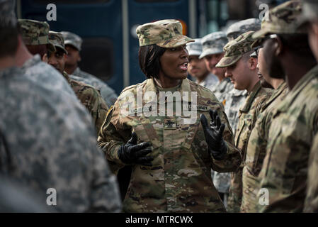 First Sgt. Selena McJimson, of Virginia Beach, Virginia, headquarters company first sergeant for the 3rd Transportation Brigade (Expeditionary), gives final instructions to her troops after a practice parade march on Joint Base Myer-Henderson Hall, Virginia, on Jan. 19 in preparation for the upcoming Presidential Inauguration Parade in Washington, D.C. During rehearsals, U.S. Army Reserve Soldiers practiced with members of the 3rd U.S. Infantry Regiment (The Old Guard), the U.S. Army Field Band, West Point and the D.C. National Guard, which totaled approximately 500 service members and cadets. Stock Photo