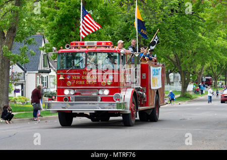 WEST SAINT PAUL, MN/USA – MAY 19, 2018: Scouts aboard fire truck during annual West Saint Paul Days Parade. Stock Photo