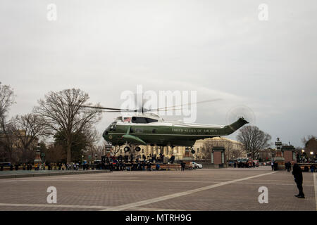 U.S. Marine One takes off from the East side of the Capitol with Former President Barack Obama and Michelle Obama onboard during the departure ceremony at the 58th Presidential Inauguration in Washington, D.C., Jan. 20, 2017. More than 5,000 military members from across all branches of the armed forces of the United States, including reserve and National Guard components, provided ceremonial support and Defense Support of Civil Authorities during the inaugural period. (DoD photo by U.S. Air Force Staff Sgt. Marianique Santos) Stock Photo