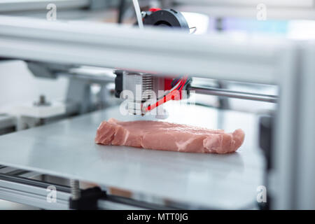 Close up of 3D printer making piece of meat Stock Photo