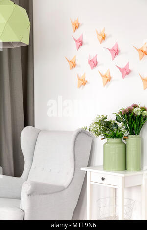 3d decoration- colorful paper origami crane on the wall Stock Photo