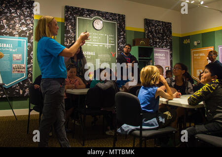 Puget Sound Naval Shipyard and Intermediate Maintenance Facility is a United States Navy installation in Bremerton, Washington, responsible for ship repair and modernization. On May 24, 2018, a K-12 STEM outreach coordinator instructed students from Armin Jahr Elementary School about bristlebots during a STEM day at the Puget Sound Navy Museum. The archival image documents the instructional segment of the educational program. Stock Photo