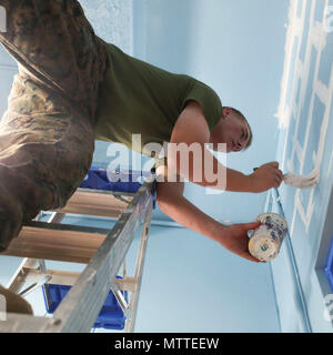 A U.S. Marine with Special Purpose Marine Air-Ground Task Force Fleet Week New York volunteers to refurbish a senior center for Habitat for Humanity in Brooklyn, New York, May 25, 2018. Fleet Week New York is an opportunity for the American public to meet their Marine Corps, Navy and Coast Guard teams and experience America’s sea services. (U.S. Marine Corps photo by Sgt. Samuel Guerra) Stock Photo