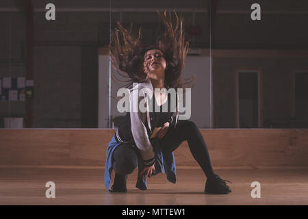 Female dancer dancing in dance studio Stock Photo
