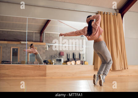 Female dancer dancing in dance studio Stock Photo