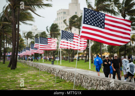 American flags are displayed along Miami Beach, Florda on May 26th, 2018, during the 2nd annual Salute to American Heroes Air and Sea Show. This two-day event showcases military fighter jets and other aircraft and equipment from all branches of the United States military in observance of Memorial Day, honoring servicemembers who have made the ultimate sacrifice. (U.S. Air Force photo/Staff Sgt. Jared Trimarchi) Stock Photo
