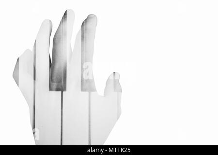 Close of hands plays melody on piano. Mobile photo isolated on white. Stock Photo