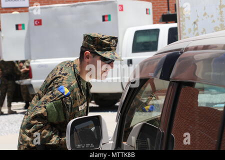 KABUL, Afghanistan (May 27, 2018) – An International Military Policeman from the Armed Forces of Bosnia and Herzegovina conducts a routine traffic patrol at Hamid Karzai International Airport, May 27, 2018. Bosnia and Herzegovina are one of 39 nations who play an integral role in the NATO-led Resolute Support mission. (Resolute Support photo by Jordan Belser)