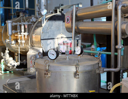 distillation of essential oils in a factory Stock Photo