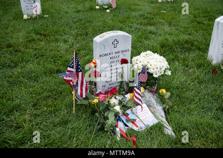 Flags, flowers and other mementos adorn the headstone of U.S. Marine Corps 1st Lt. Robert Michael Kelly, son of Chief of Staff John Kelly, in Section 60 of Arlington National Cemetery, Arlington, Virginia, May 28, 2018. Every year over Memorial Day weekend, over 135,000 visitors come to Arlington National Cemetery to honor those who have died while in the armed forces. (U.S. Army photo by Elizabeth Fraser / Arlington National Cemetery / released) Stock Photo