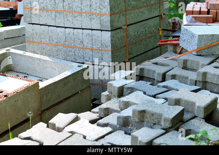 cement construction elements in stacks lying at construction site Stock Photo